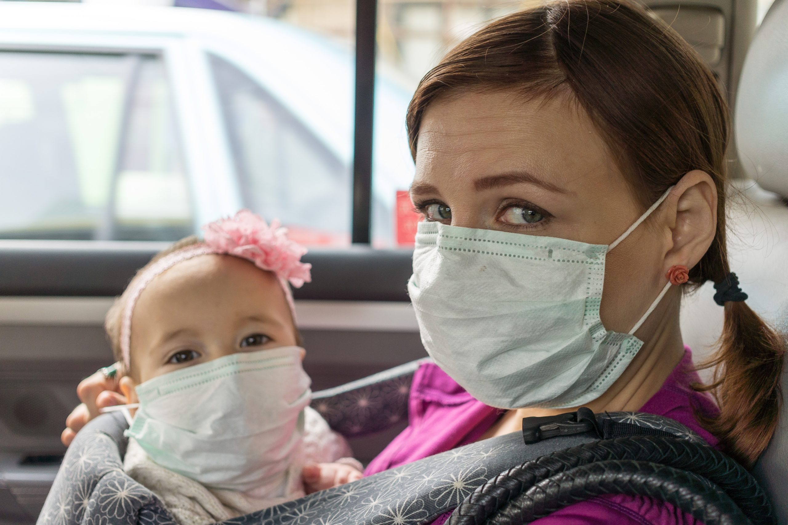 Woman and toddler wearing a face mask