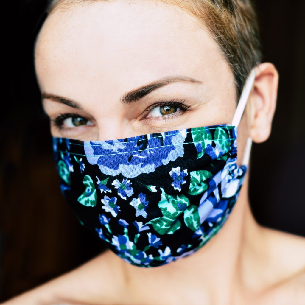 Woman wearing colored face mask