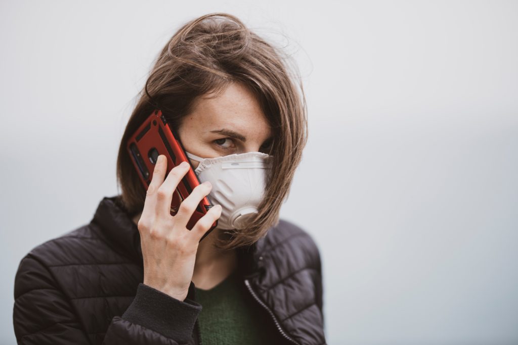 Woman wearing a N95 mask style