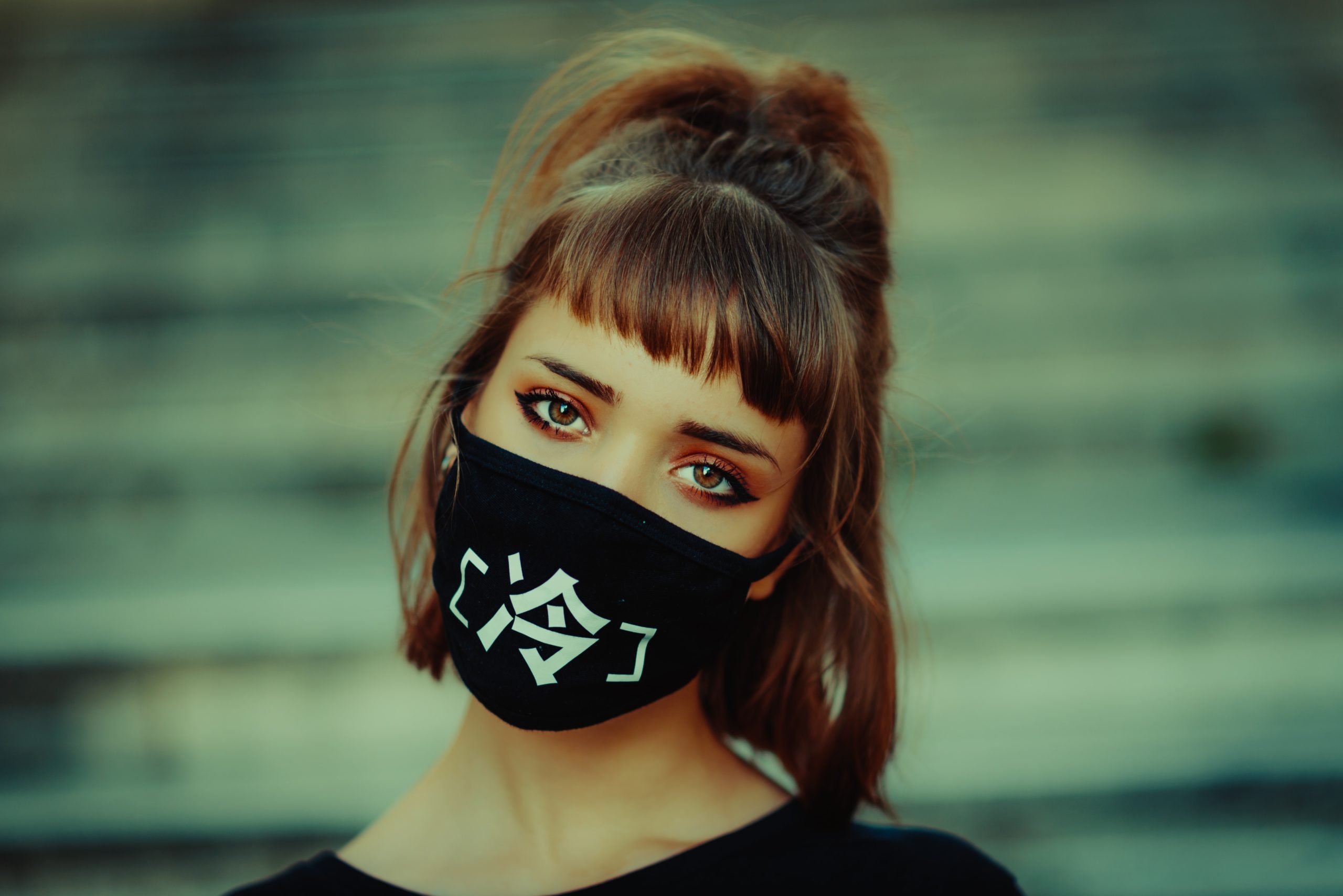 Woman wearing a black face mask
