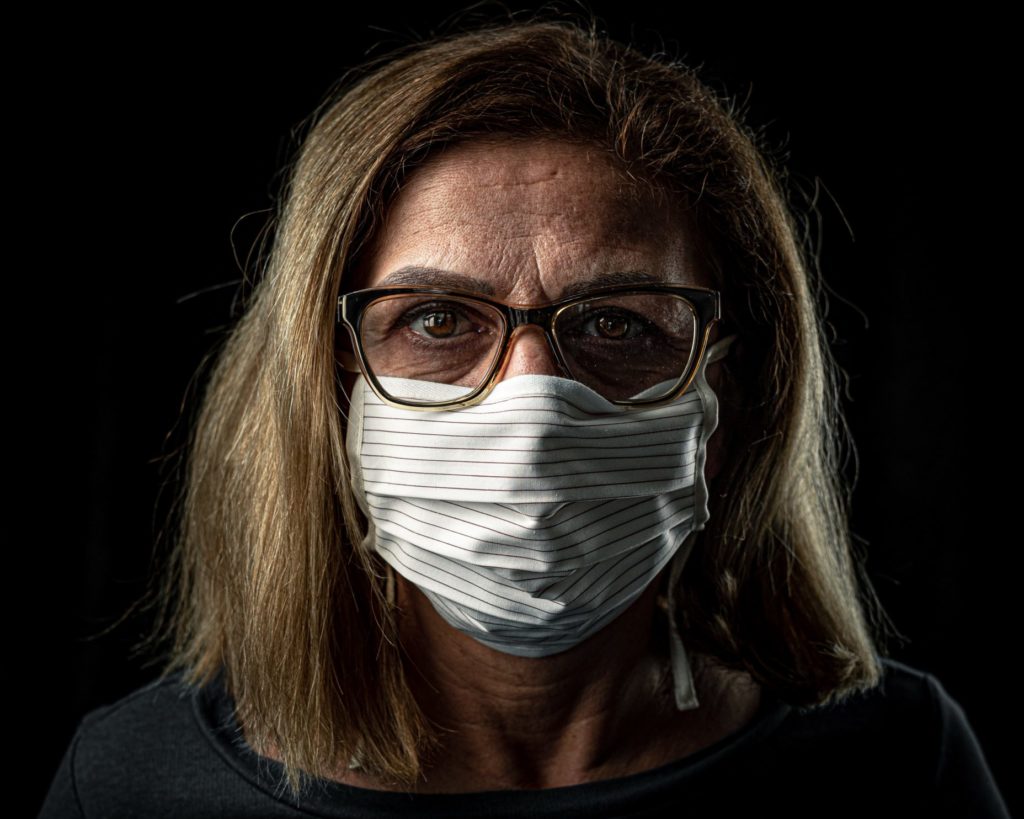 Woman wearing glasses and a face mask