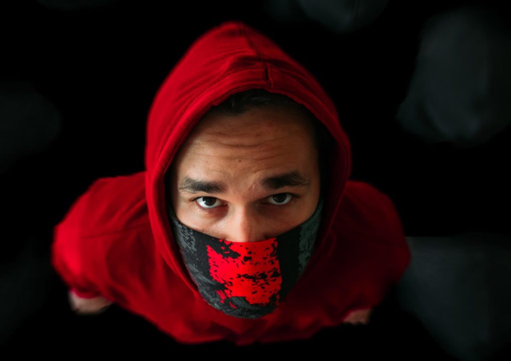 Man wearing a red mask 