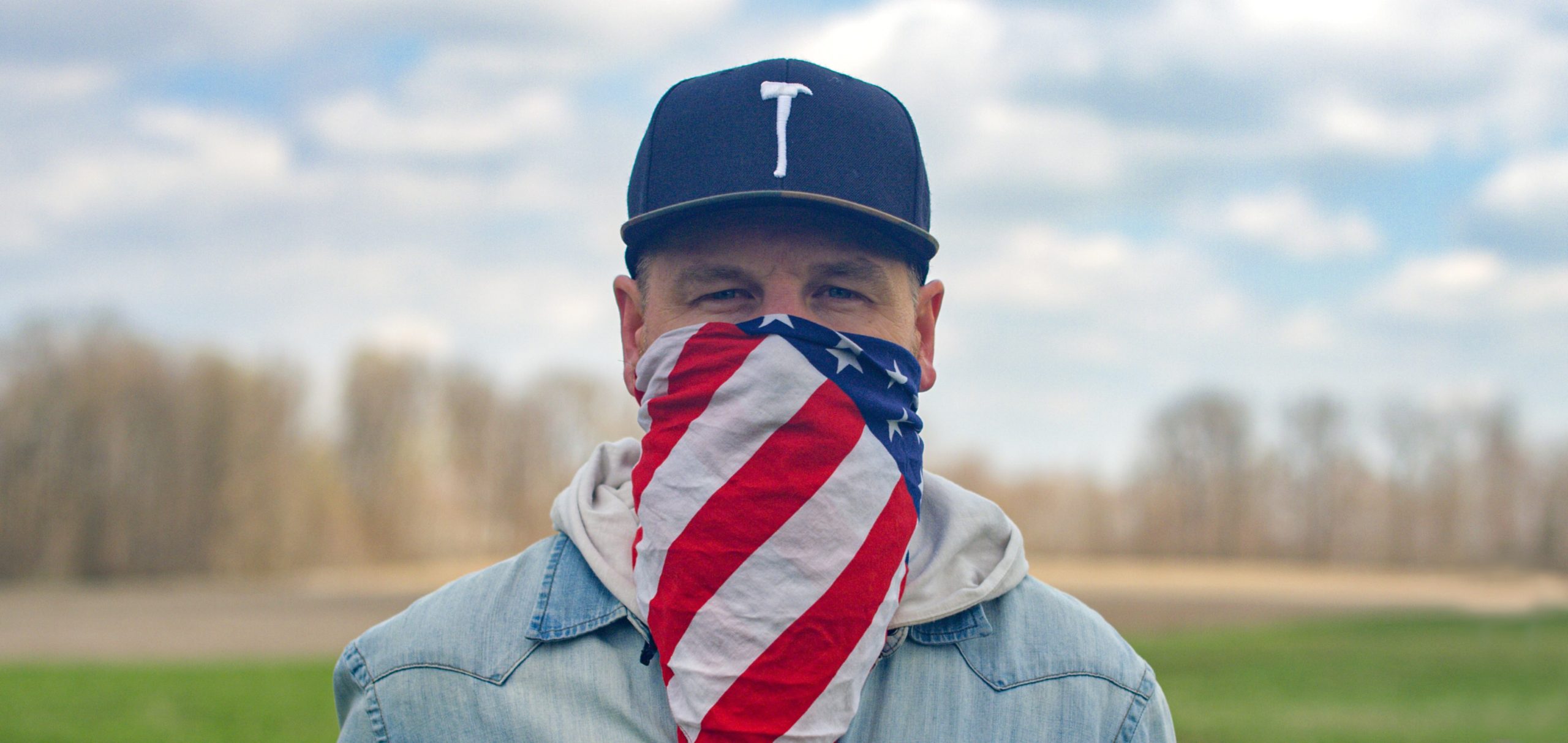 Man wearing flag as a face mask