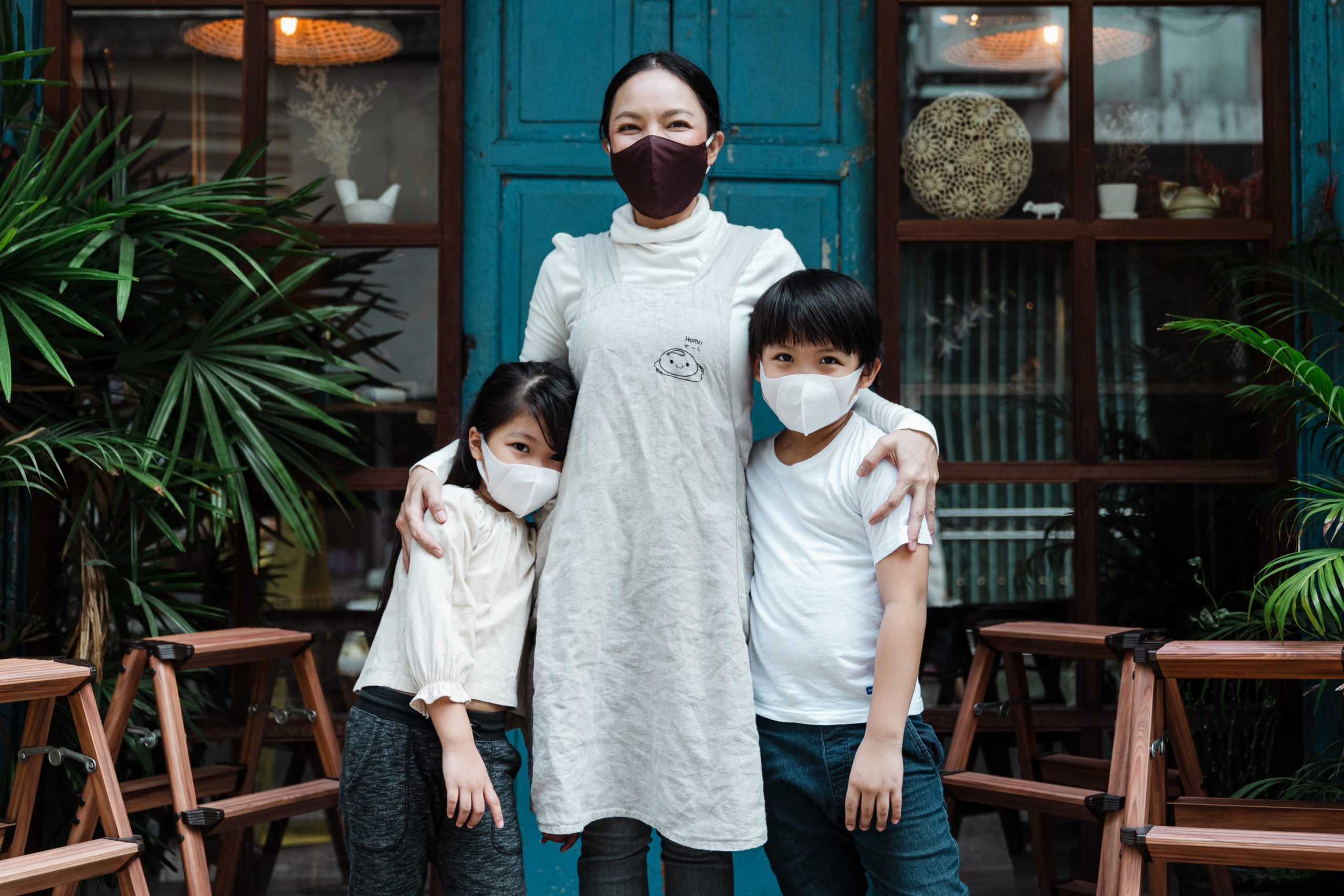 Woman and kids wearing masks